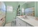 A bathroom featuring a white sink, nautical decor, and a themed shower curtain at 4399 Dior Rd, Spring Hill, FL 34609