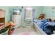 This charming bedroom is decorated with a bed, TV, dresser, and mermaid decor at 4399 Dior Rd, Spring Hill, FL 34609