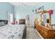 Large bedroom with ceiling fan, en-suite access, and wood-look floors at 4399 Dior Rd, Spring Hill, FL 34609