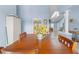 Open dining area with neutral walls and floors, and a view into a bright living space, creating an airy atmosphere at 4399 Dior Rd, Spring Hill, FL 34609
