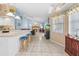 Spacious kitchen with breakfast bar open to the living room and fireplace at 4399 Dior Rd, Spring Hill, FL 34609