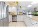 Bright kitchen featuring stainless steel appliances and ample counter space, open to the living areas at 4399 Dior Rd, Spring Hill, FL 34609