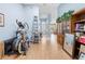 Spacious living room with wood floors, a tall ceiling, and lots of natural light at 4399 Dior Rd, Spring Hill, FL 34609