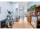 Spacious living room with wood floors, a tall ceiling, and lots of natural light at 4399 Dior Rd, Spring Hill, FL 34609