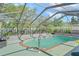 Screened in pool with brick trim and clear blue water at 4399 Dior Rd, Spring Hill, FL 34609