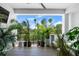 Inviting balcony with lush greenery, comfortable seating, and panoramic views of a tropical landscape at 4515 W North A St # 6, Tampa, FL 33609