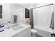 Modern bathroom featuring a bathtub with white subway tile surround and a white vanity with sink at 4515 W North A St # 6, Tampa, FL 33609