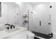 Modern bathroom featuring a glass-enclosed shower, floating shelves, and sleek fixtures at 4515 W North A St # 6, Tampa, FL 33609