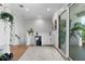 A bright flex space featuring a wet bar, neutral walls, light wood floors, and access to the private outdoor deck at 4515 W North A St # 6, Tampa, FL 33609