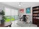 Well-lit office featuring a built-in bookcase, neutral paint, and a window overlooking a private outdoor space at 4515 W North A St # 6, Tampa, FL 33609