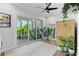 Bright room featuring sliding doors to balcony, modern decor, and indoor plants, creating serene ambiance at 4515 W North A St # 6, Tampa, FL 33609