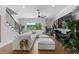 Bright living room featuring a large sofa, hardwood floors, and large windows at 4515 W North A St # 6, Tampa, FL 33609