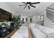 Spacious living room with a large TV, modern furniture, hardwood floors, and an open floor plan at 4515 W North A St # 6, Tampa, FL 33609