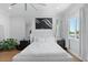 Bright main bedroom featuring hardwood floors, neutral decor, and large windows at 4515 W North A St # 6, Tampa, FL 33609