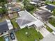 Aerial view of the property with the home, driveway, and backyard at 4705 Murray Hill Dr, Tampa, FL 33615