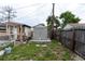 Backyard featuring outbuildings, utility storage, and fenced-in yard space at 4705 Murray Hill Dr, Tampa, FL 33615