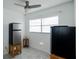 White room with tile floors, stainless steel mini fridge, and window at 4705 Murray Hill Dr, Tampa, FL 33615