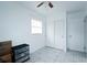 Bedroom with tile floors, closet, and ceiling fan at 4705 Murray Hill Dr, Tampa, FL 33615