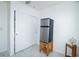 White room with tile floors, stainless steel mini fridge, and closet at 4705 Murray Hill Dr, Tampa, FL 33615