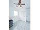 Bedroom features tile floors, closet, and ceiling fan at 4705 Murray Hill Dr, Tampa, FL 33615
