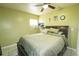 Comfortable bedroom with a full size bed, ceiling fan, and a window at 4705 Murray Hill Dr, Tampa, FL 33615