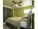 Comfortable bedroom with a full size bed, ceiling fan, and a window at 4705 Murray Hill Dr, Tampa, FL 33615