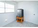 White room with stainless steel mini fridge and tile floors at 4705 Murray Hill Dr, Tampa, FL 33615