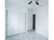 Bedroom featuring tile floors and closet with sliding doors at 4705 Murray Hill Dr, Tampa, FL 33615
