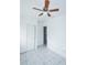 Bedroom featuring tile floors, ceiling fan, and closet with sliding doors at 4705 Murray Hill Dr, Tampa, FL 33615