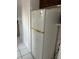 Kitchen features a white refrigerator next to shelving units and an open door at 4705 Murray Hill Dr, Tampa, FL 33615