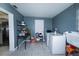 Functional laundry room with modern washer and dryer, tile floors, and ample storage space at 4705 Murray Hill Dr, Tampa, FL 33615