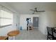Bright living room with tile flooring and natural light, features a modern ceiling fan and neutral decor at 4705 Murray Hill Dr, Tampa, FL 33615