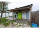 Backyard patio featuring a grill, storage, and seating, with a fenced-in yard space at 4705 Murray Hill Dr, Tampa, FL 33615