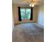 Bedroom featuring plush carpet and a ceiling fan for added comfort at 500 Belcher S Rd # 109, Largo, FL 33771