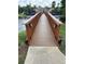 Wooden bridge in a beautiful community with a pond at 500 Belcher S Rd # 109, Largo, FL 33771