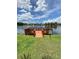 Community lake dock with seating providing a serene spot to enjoy the waterfront views and natural beauty at 500 Belcher S Rd # 109, Largo, FL 33771