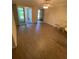 Bright living room with wood floors and sliding glass doors to the porch at 500 Belcher S Rd # 109, Largo, FL 33771