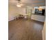 Open-concept living and dining area with hardwood floors at 500 Belcher S Rd # 109, Largo, FL 33771