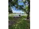 Picturesque picnic area near the lake offering a perfect spot for outdoor dining and relaxation under the trees at 500 Belcher S Rd # 109, Largo, FL 33771