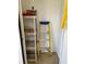 Small storage space featuring shelving with assorted maintenance and cleaning supplies at 500 Belcher S Rd # 109, Largo, FL 33771
