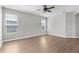 A simple bedroom with great natural light from two windows and a ceiling fan at 5015 58Th E Ter, Bradenton, FL 34203