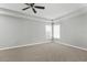 Spacious bedroom featuring neutral carpet and a ceiling fan, perfect for creating a relaxing retreat at 5015 58Th E Ter, Bradenton, FL 34203
