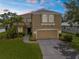 A well-maintained two story home with a two-car garage, lush lawn, and mature landscaping at 5015 58Th E Ter, Bradenton, FL 34203