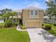Charming two-story home featuring a two-car garage, mature landscaping, and a well-manicured lawn at 5015 58Th E Ter, Bradenton, FL 34203