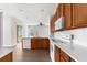 Bright kitchen features stainless appliances, wood cabinets, and a view to the backyard at 5015 58Th E Ter, Bradenton, FL 34203