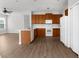 Kitchen with an island, stainless appliances, wood cabinets and an attached dining area at 5015 58Th E Ter, Bradenton, FL 34203