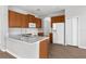 A kitchen with an island, stainless appliances and wood cabinets offers ample space for cooking at 5015 58Th E Ter, Bradenton, FL 34203