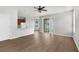 Open-concept layout from living area to kitchen with sliding glass door to backyard at 5015 58Th E Ter, Bradenton, FL 34203