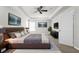 Luxurious primary bedroom suite with stylish decor, a ceiling fan, and a modern aesthetic at 5015 58Th E Ter, Bradenton, FL 34203