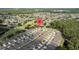 Aerial view of a well-planned community featuring homes surrounding a golf course and natural pond at 5131 Gato Del Sol Cir, Wesley Chapel, FL 33544